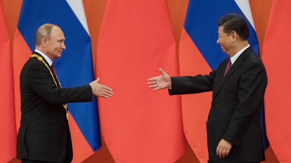 Presidente de Rusia, Vladimir Putin y el presidente de China, Xi Jinping - Sputnik Mundo