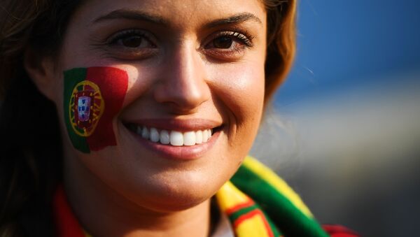 A fan of the Portugal national team before the start of a group stage match between Portugal and Spain. - Sputnik Mundo