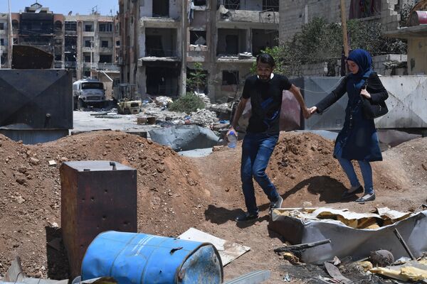 Durante los combates en Siria fueron destruidas numerosas ciudades y edificios de valor histórico. En la foto: el antiguo campo de refugiados palestinos Yarmuk, al sur de la ciudad de Damasco, mayo de 2018. - Sputnik Mundo