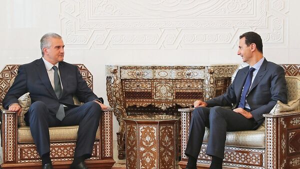 El líder de la república de Crimea, Serguéi Aksyonov, y el presidente de la República Árabe Siria, Bashar Assad. - Sputnik Mundo