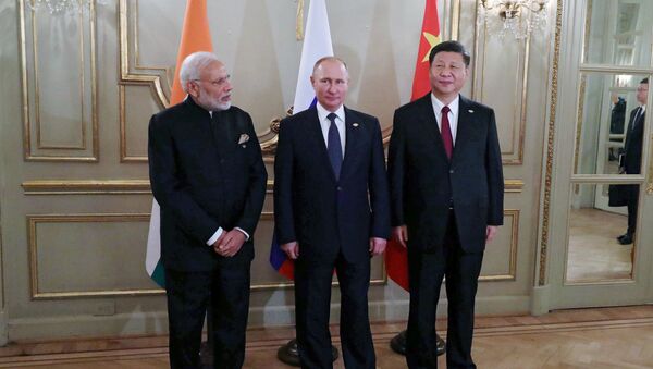 El primer ministro de India, Narenda Modi, presidente de Rusia, Vladímir Putin, y el presidente de China Xi Jinping en G20 en Buenos Aires, Argentina - Sputnik Mundo