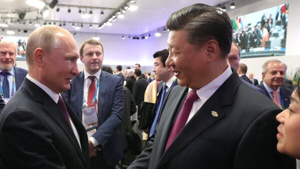 Vladímir Putin, presidente de Rusia, y Xi Jinping, líder chino - Sputnik Mundo