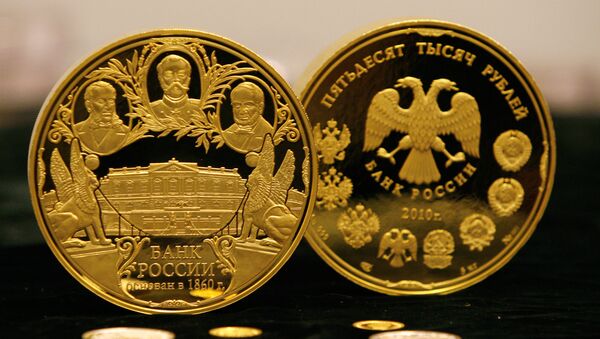 Unas monedas de oro del Banco de Rusia (archivo) - Sputnik Mundo