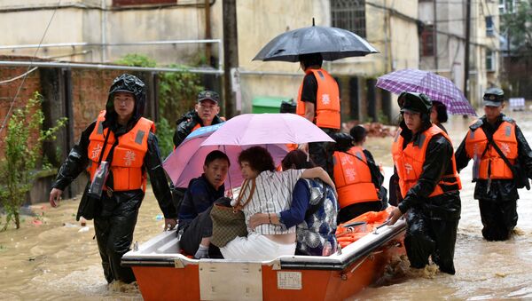 La evacuación en China por lluvias torrenciales - Sputnik Mundo