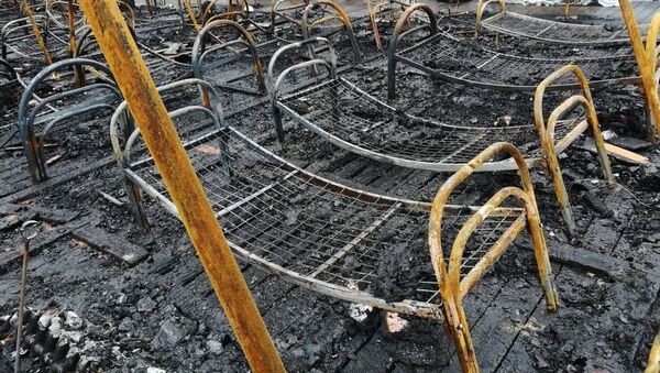 Consecuencias del incendio en un campamento del este de Rusia - Sputnik Mundo