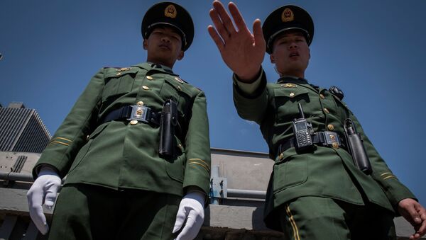 Dos policías chinos (imagen referencial) - Sputnik Mundo