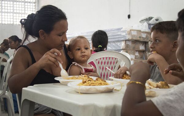 Refugiados venezolanos en Manaos, Brasil - Sputnik Mundo