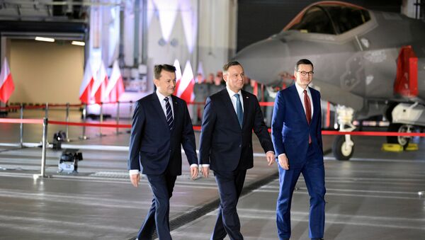 El ministro de Defensa polaco, Mariusz Blaszczak, el presidente, Andrzej Duda, y el primer ministro, Mateusz Morawiecki - Sputnik Mundo