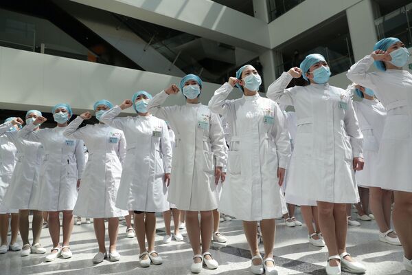 Nurses take part in an event held to mark the International Nurses Day in Wuhan - Sputnik Mundo