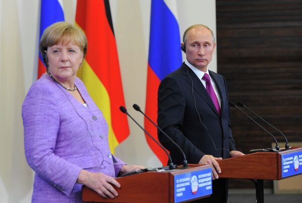 El presidente de Rusia, Vladímir Putin, y la canciller de Alemania, Angela Merkel (Archivo) - Sputnik Mundo