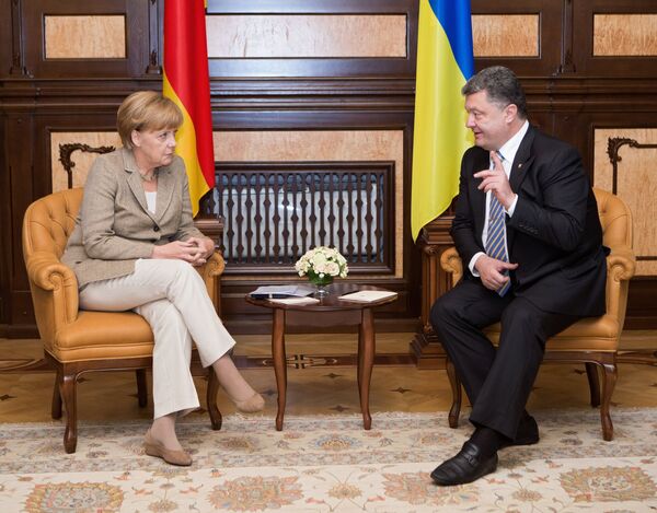 Angela Merkel, canciller de Alemania y Petró Poroshenko, presidente de Ucrania - Sputnik Mundo