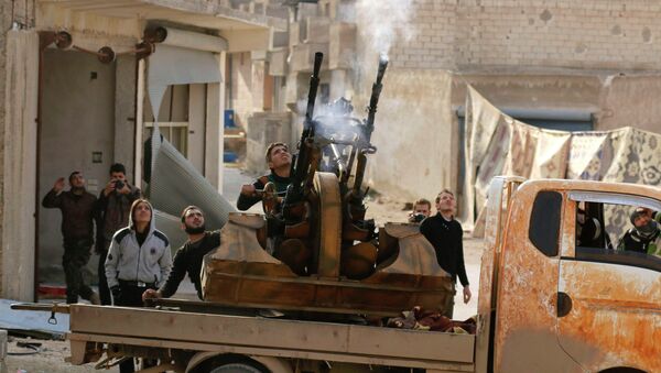 Free Syrian Army fighters fire an anti-aircraft weapon towards forces loyal to Syria's President Bashar al-Assad in the Handarat area, north of Aleppo November 30, 2014 - Sputnik Mundo